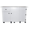 The Sullivans Quilter's Design Table is a versatile, space-saving craft station perfect for quilters and sewists. It features a foldable top with a helpful grid, integrated storage, and lockable casters for easy mobility