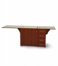 This cabinet is designed for sewists who need a combination of a spacious work area, a convenient machine lift, and ample built-in storage, all within a footprint that can be closed up when not in u